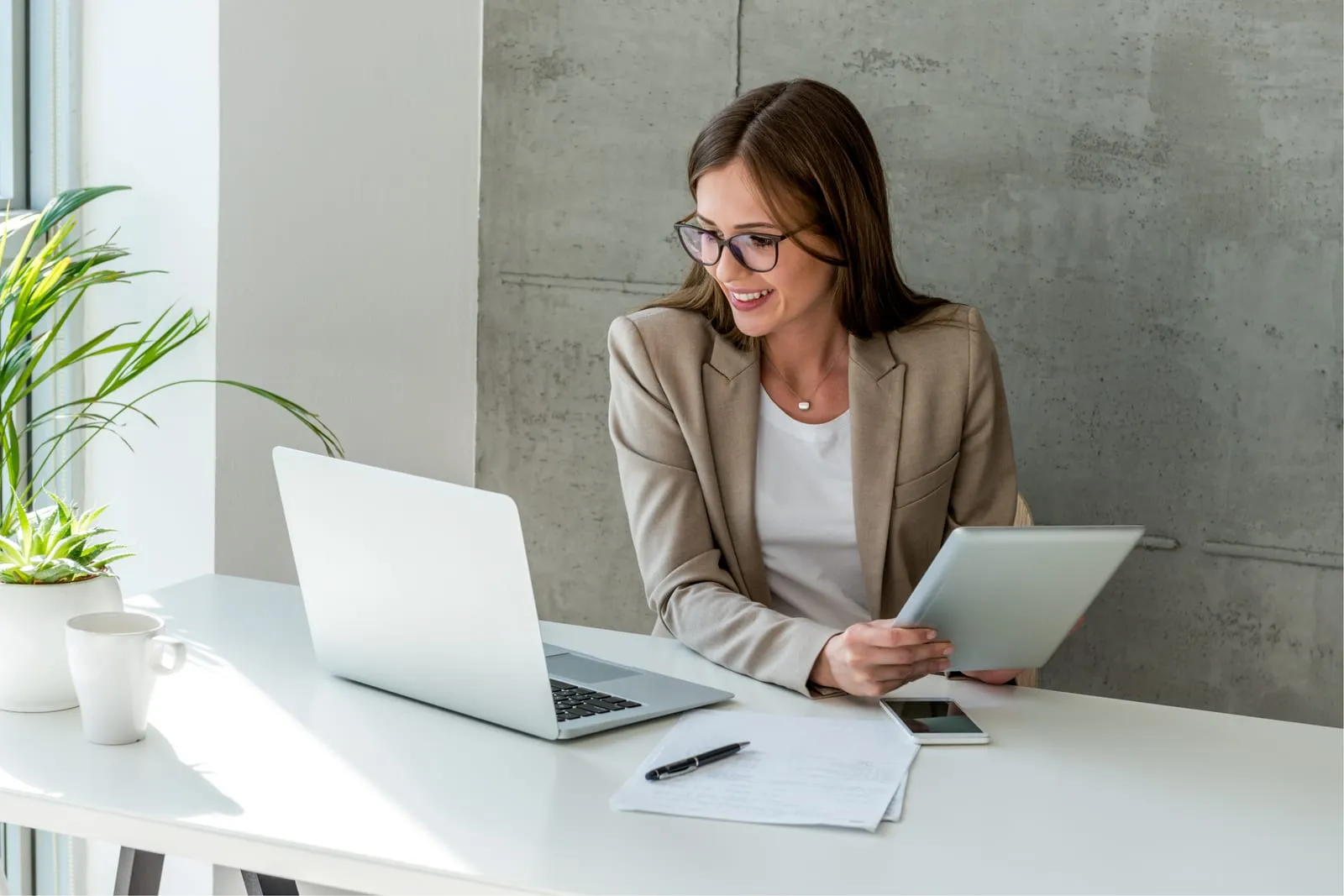 Two colleagues talking at a desk